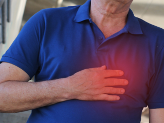 A man grasping his chest.